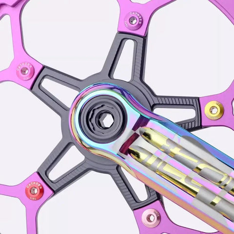 Pink 5 Pack 7075 Aluminum Chainring Bolts for Road and MTB Cranksets, 6.5mm nuts, on black and pink bike crankset