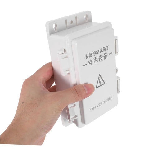Hohopeti Heavy Duty Waterproof Electrical Junction Box for Outdoor Wiring being held, sturdy plastic design for camera setup.