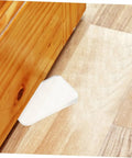 Clear Plastic Leveling Shims For Furniture Wobble Fix 32 Piece Wedge Set stabilizing wooden furniture on uneven floor.