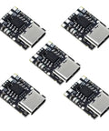 Five Tp4057 1A Lithium Ion Battery Charging Modules With Type C USB hookup, compact design for DIY tech projects.