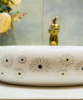 Slick Ceramic Oval Vessel Sink For Modern Bathroom Counters with floral design and smooth glazed finish.