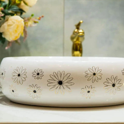 Slick Ceramic Oval Vessel Sink For Modern Bathroom Counters with floral design and smooth glazed finish.