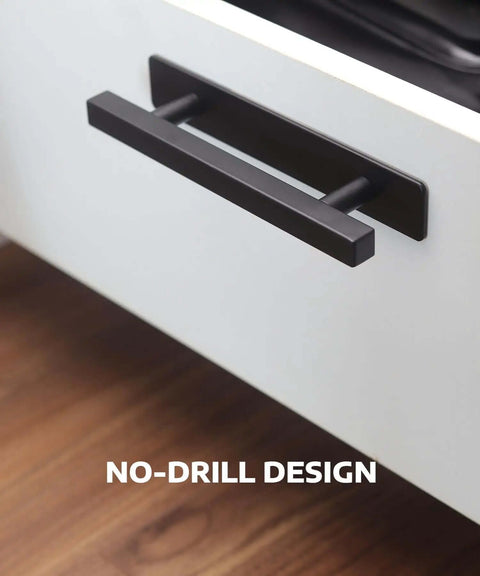 Stick On Cabinet Handles Matte Black 6 Inch No Drill Drawer Pulls shown on white cabinet with wood floor