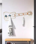 Modern Wall Mount Coat Hooks Dang Handy Entryway Storage Rack Easily Hangs Coats Jackets And Keys With Heavy Duty Steel Frame Built For Everyday Grind At Home, guitar-shaped coat rack with white coat and umbrella.