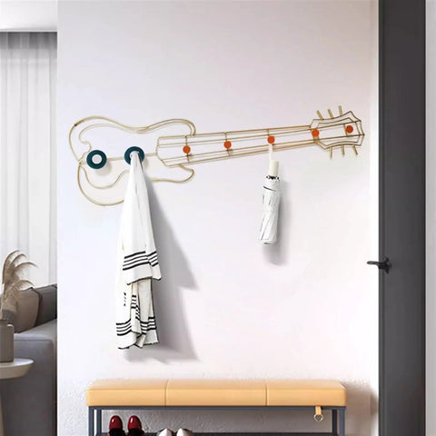 Modern Wall Mount Coat Hooks Dang Handy Entryway Storage Rack Easily Hangs Coats Jackets And Keys With Heavy Duty Steel Frame Built For Everyday Grind At Home, guitar-shaped coat rack with white coat and umbrella.