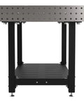 Heavy Duty Welding Fixture Table With Precision Laser Cut Holes And Storage Shelf Built Beefy For Garage Shop Projects showing a sturdy metal frame with a lower shelf.