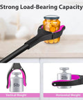 Front view of a 36-inch foldable reacher tool with pink interior grip grabbing a jar on a kitchen counter.