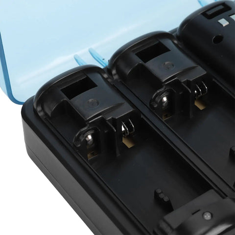 Close-up of Four In One Remote Charging Station for controllers with open battery slots and blue cover.
