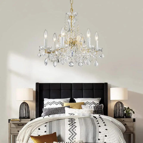 Modern Crystal Chandelier Light Fixture With Six Lights, Raindrop Pendant Crystals In Maria Theresa Brass Finish in bedroom
