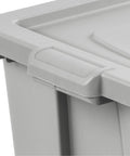 Close-up of a gray lid and handle of Tough As Nails 30 Gallon Storage Bins With Secure Lids Heavy Duty Plastic Totes.
