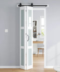 Double 18x84 White Frosted Glass Bifold Barn Door Set, 36x84 Inch With 40 Inch Hardware Kit, installed in a modern room