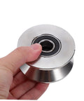 Heavy Duty Stainless Steel Sliding Door Rollers U Groove Caster Wheels with smooth glide track, hand-held close-up view.