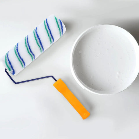 Two Piece Seamless Corner Paint Roller With Dual Grip Handles For Conquering Wall Edges And Tight Corners Lint Free Rolling Design on a white background next to a paint container.
