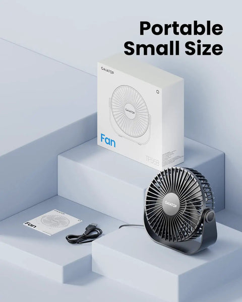 Compact black USB Desk Fan with packaging on light background; USB cable included. USB Desk Fan With 3 Speeds, Ultra Quiet Go-To Personal Table Fan For Home Office And Travel, 5.5 Inch Portable Cooling, 90 Degree Tilt, Compact Black, Your Everyday Cool On Hot Days.