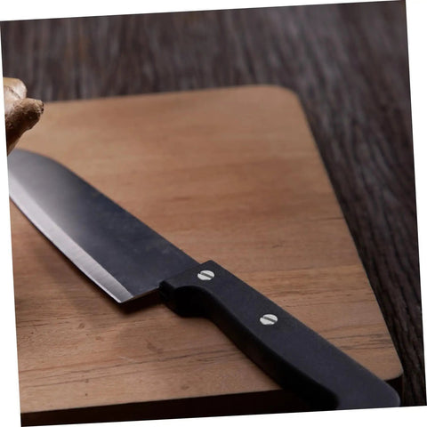 Knife with black handle on a wooden board showcasing Locking Knife Handle Rivets Kit Pro Grade Two Piece Durable Stainless Steel Fasteners