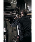 Mechanic using Heavy Duty Half Inch Drive Air Impact Wrench With Up To 1350 Foot-Pounds Of Nut Busting Torque for repair