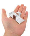 Heavy Duty Galvanized Saddle Clips For Steel Grating shown in hand, silver carbon steel clamp for secure industrial walkway installation.