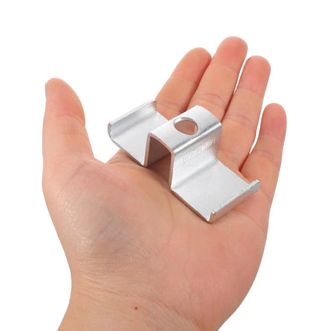 Heavy Duty Galvanized Saddle Clips For Steel Grating shown in hand, silver carbon steel clamp for secure industrial walkway installation.