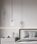 Clear glass pendant light with brushed nickel finish hanging in bedroom, part of 3 Pack Clear Glass Vintage Pendant Lights With Brushed Nickel Finish For Kitchen Island Sleek Modern Glass Ceiling Hanging Lights For Dining Room Kitchen Bar Area.