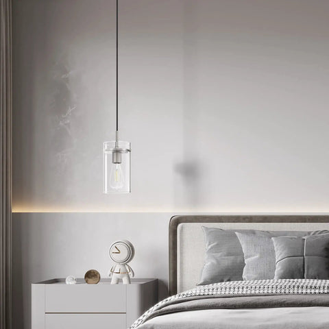 Clear glass pendant light with brushed nickel finish hanging in bedroom, part of 3 Pack Clear Glass Vintage Pendant Lights With Brushed Nickel Finish For Kitchen Island Sleek Modern Glass Ceiling Hanging Lights For Dining Room Kitchen Bar Area.