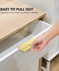 Premium Gold Cabinet Handles Finger Edge Pulls sleek brushed finish being used to open a drawer with ease.
