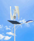 100W Vertical Axis Wind Turbine Kit For Home Power With Controller And 4 Blade Permanent Magnet Generator Built For Hybrid Solar Wind Systems That Delivers Plug And Play Power Quiet Durable Performance White 12V Wind Turbine installed on a pole with blue sky background