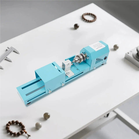 Mini Metal Wood Lathe Machine Corded Electric Compact Desktop Milling Tool For Small-Leaf Rosewood Craft Projects on a workbench.