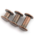 Close-up of three 75 Piece Red Bronze Chicago Bindery Screw Assorted Kit M5 M5x6 M5x10 M5x12 for book binding.
