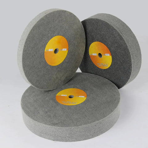 Three grey wheels from the Nylon Fiber Polishing Wheel With Buffing Pad And Grinding Discs 5 Pack for polishing jobs.
