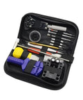 Open case showing 147 Piece Watch And Clock Repair Tool Kit With Link Pin Dissolver And Strap Opener Housing Back Opener