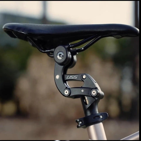 Close-up of suspension seatpost with 4-link parallelogram system for road gravel MTB and E bikes, 27.2 to 33.9mm fit.