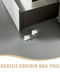 30 Pcs Heavy Duty Double Wheel Curtain Track Rollers Providing A Slam Dunk Upgrade With Durable Alloy Plastic Build And Silent Glide For Foolproof Room Refresh, two white pulleys on floor near furniture.