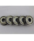 Top Notch F609ZZ Flanged Deep Groove Ball Bearings 9x24x7mm Precision Steel ABEC-1 Grade multiple units on a surface.