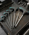 Check Out This Awesome T Type Hex Key Set With 7 Pieces That Make Auto Repair And Furniture Assembly Super Easy And Provide Serious Grip For Stripped Bolts. 7-piece black steel T-handle hex keys on a workbench