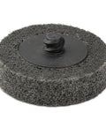 Close-up of a 2-inch grey ultra-fine silicon carbide disc, Type R, for surface prep and quick change attachment on metals.