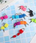 10 Pack Small Luggage Locks With Keys on blue grid; colorful durables metal padlocks for travel, school gym; copper and ABS material