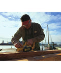 Pro Grade 20V Max Xr Brushless Cordless Planer Drops Dead Serious Amps For Zero Drag Wood Planing And Cabinet Refinishing Job Site Ready Tool Only Renewed in use on wood at a dock.
