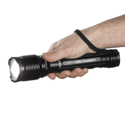 Person holding Redline Big Daddy Flashlight 2000 Lumen Waterproof Tactical Light With 4X Adjustable Zoom, rugged aluminum build, bright beam