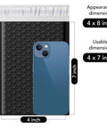 Black Bubble Mailers 4x8 Inches, 100 Pack Waterproof Padded Envelopes With Self Seal Usable 4x7 Inner Size, shown with a phone