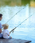 Father and son fishing with Grab And Go Pocket Telescopic Fishing Rod And Reel Combo by a lake