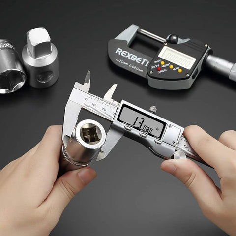 Person using 6 Inch Digital Caliper With Stainless Steel Polished Finish, Inch Millimeter And Fraction Readouts on metal rod