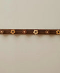 Dang Cute Flower Peg Wall Mount Coat Rack For Kids Crafted From Solid Walnut Wood Storage features flower-shaped hooks.
