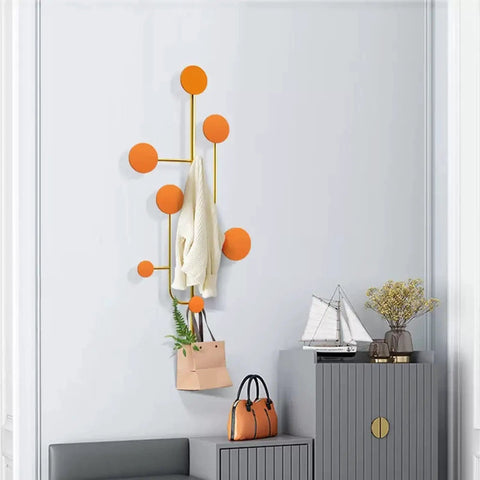 Hella Sturdy Wall Mount Coat Rack With Creative Cloak Hooks For Entryway Organization, displaying orange hooks and a light sweater.