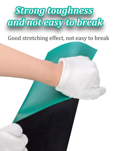 Hands stretching and showing durability of Anti Static Rubber Soldering Mat For Workbench Built Tough With High Temperature Resistance.