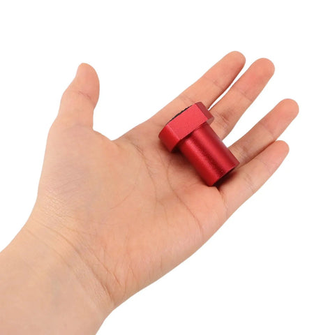 Hand holding red aluminum item from 8 Pack Aluminum Alloy Non Slip Limit Cards For Workbench And Woodworking Table Keep Your Setup Steady