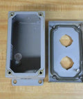 Industrial Control Panel Enclosure 2PB Series with two-hole cover on wooden surface