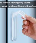 Hand peeling Clear Wall Protectors 6 Pack For Furniture Fridge Door Stopper With Strong Adhesive Backing Bumper Guards off a surface