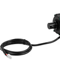 Side view of a black electric linear actuator with a coiled cable and a two-pin white connector.