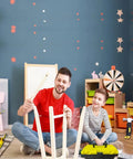 Father and son using "Kids Real Tools Set 30 Piece Builders Kit With Tool Box Hammer Phillips And Flat Screwdrivers Clamps Gloves Safety Goggles" in playroom