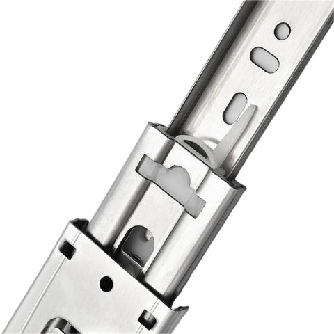 Close-up of smooth stainless steel heavy duty drawer slides with soft close extending from 10 to 22 inches three section cabinet rails.